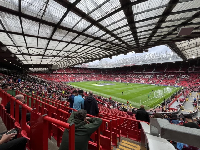 Picture looking diagonally across the pitch at Old Trafford as the stadium begins to fill ahead of kick off